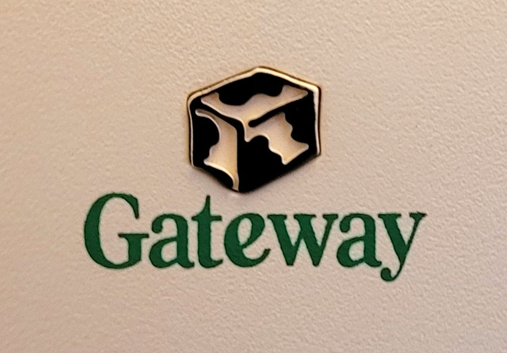 The 1998 Gateway 2000 logo with the word "Gateway" in green and an abstract cow-print isometric box above it.